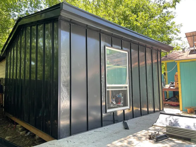 Black standing seam metal wall panels for Roof Inspection in Lacombe