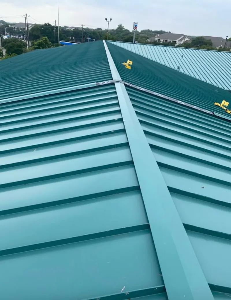 Green commercial metal roof ridge and valley for Metal Roof Repair in Lacombe