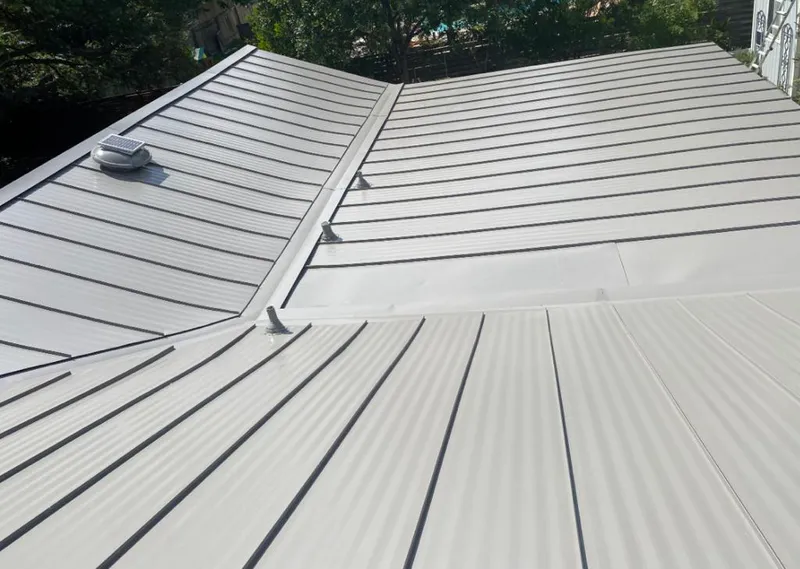Solar attic fan installed on a metal roof for Roof Ventilation in Lacombe